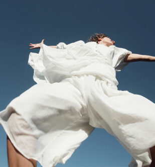 Girl in white is moving in the sky