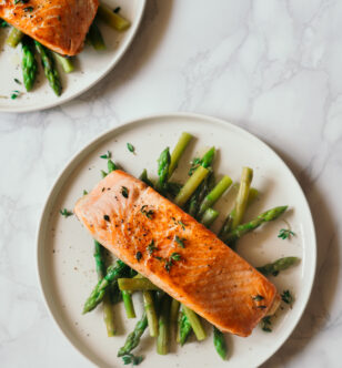 Baked salmon pairs well with asparagus for a complete meal.