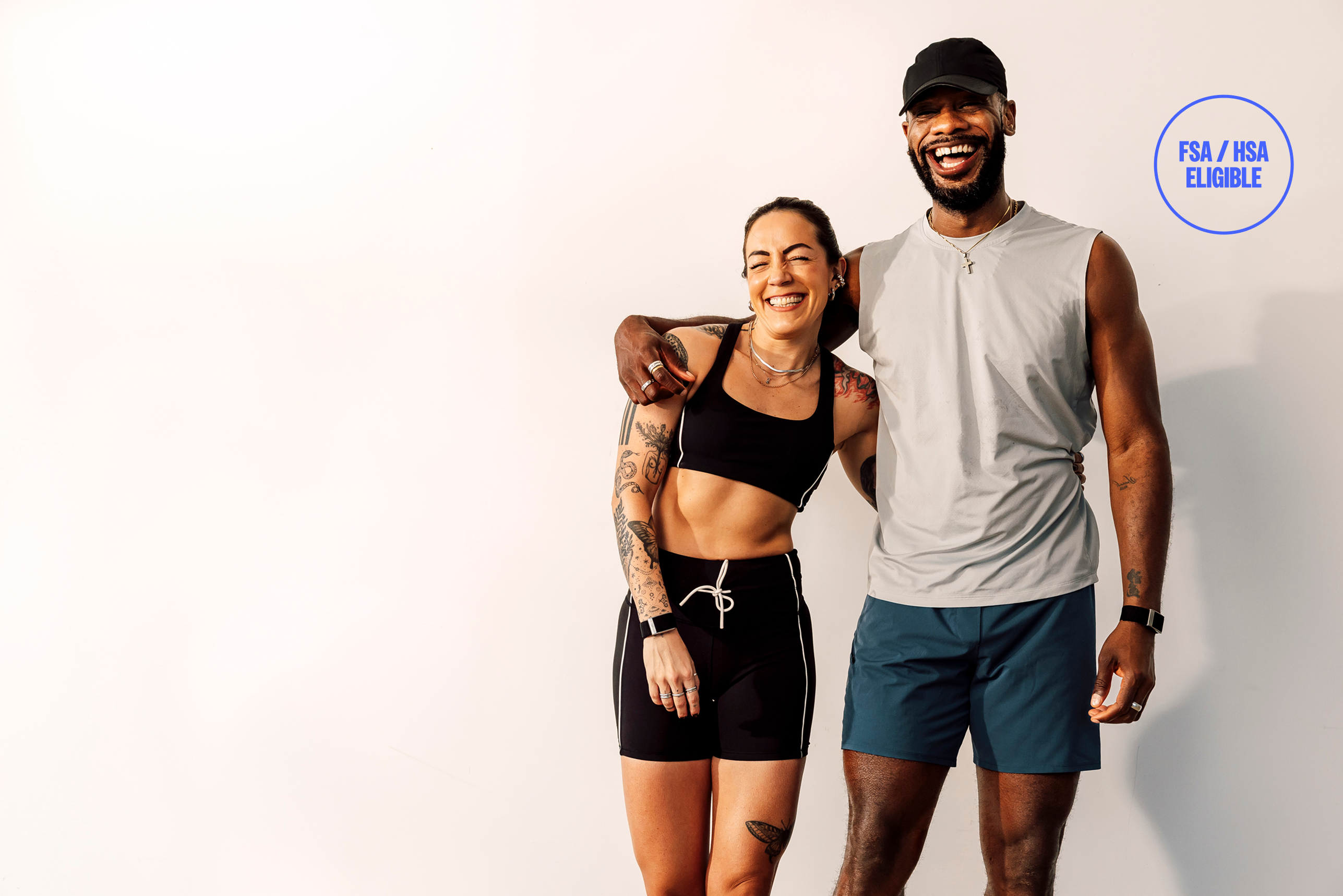 Two people smiling after a workout