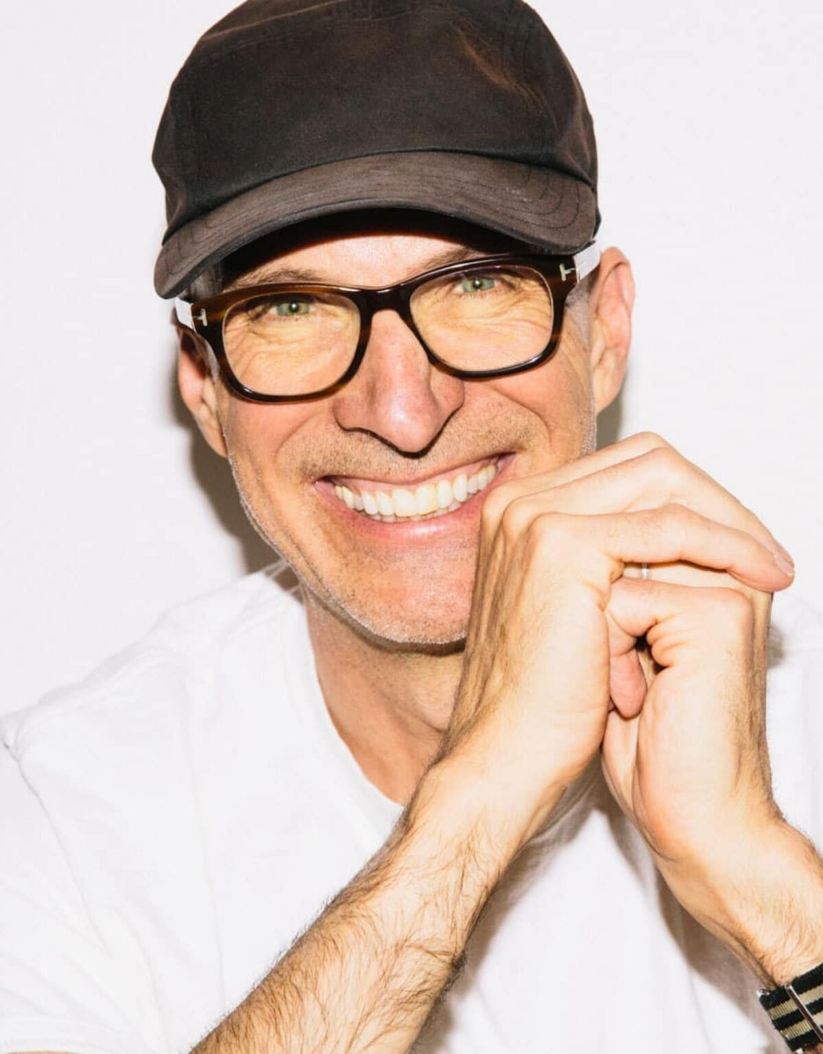 David Stewart, smiling, in a cap and glasses